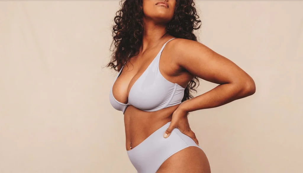 Woman in gray underwear posing